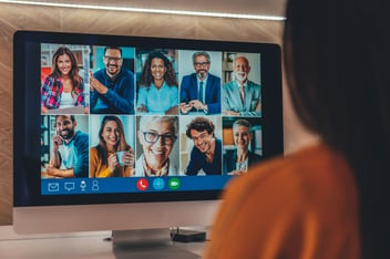 Modern Multiethnic business team having discussion and online meeting in video call